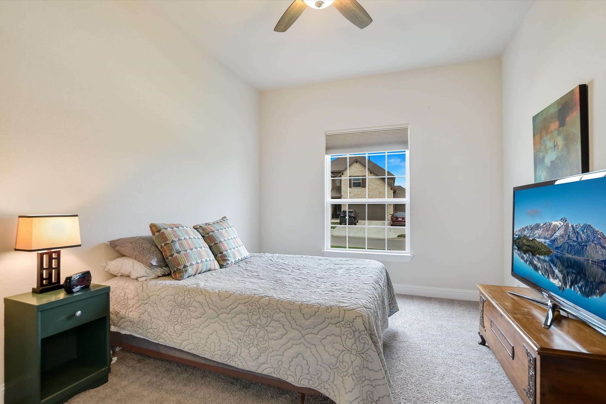 2009 Waterview Road Georgetown, TX 78628 - Photo 15 of 22 a bedroom with a bed and a chandelier