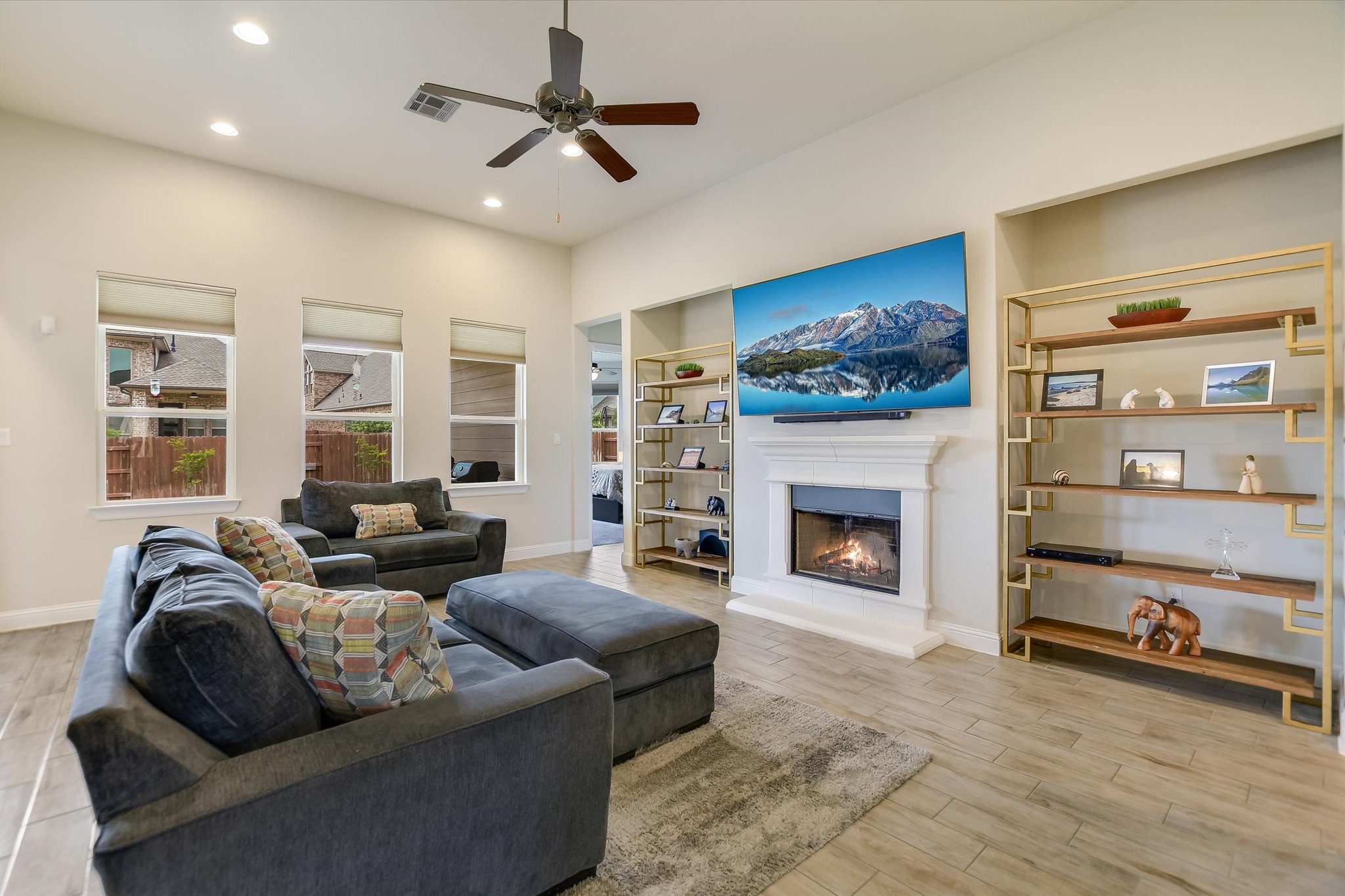 2009 Waterview Road Georgetown, TX 78628 - Photo 4 of 22 a living room with furniture a fireplace and a flat screen tv