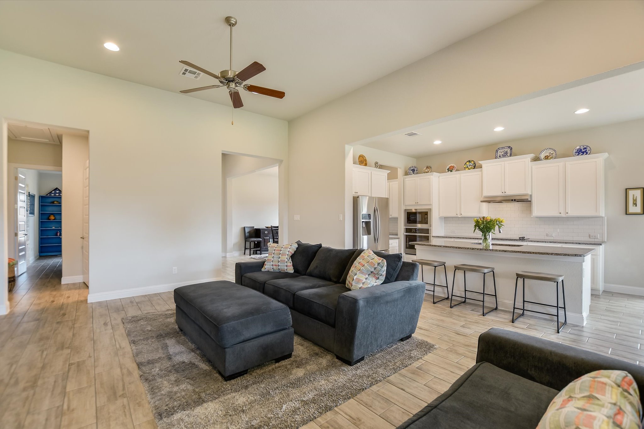 2009 Waterview Road Georgetown, TX 78628 - Photo 6 of 22 a living room with furniture kitchen view and a wooden floor