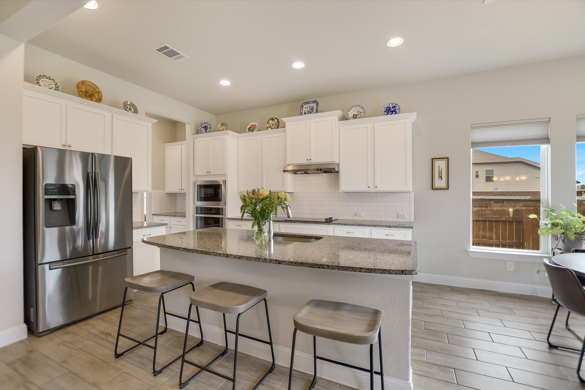 2009 Waterview Road Georgetown, TX 78628 - Photo 8 of 22 a kitchen with stainless steel appliances granite countertop a refrigerator and a stove top oven