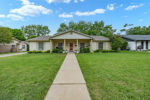 a front view of a house with yard