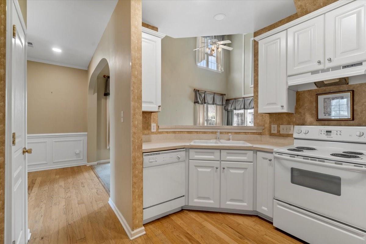 2307 Mirage Place Fort Mill, SC 29708 - Photo 8 of 30 a kitchen with white cabinets and white appliances