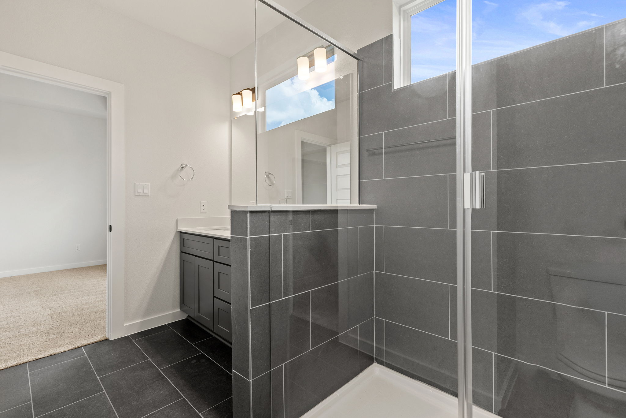 2600 Gattis School Road, Unit 1002 Round Rock, TX 78664 - Photo 22 of 40 A well-appointed bathroom with a spacious walk-in shower and modern tile work.