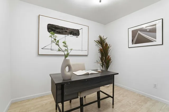 a bathroom with a shower sink vanity mirror and toilet
