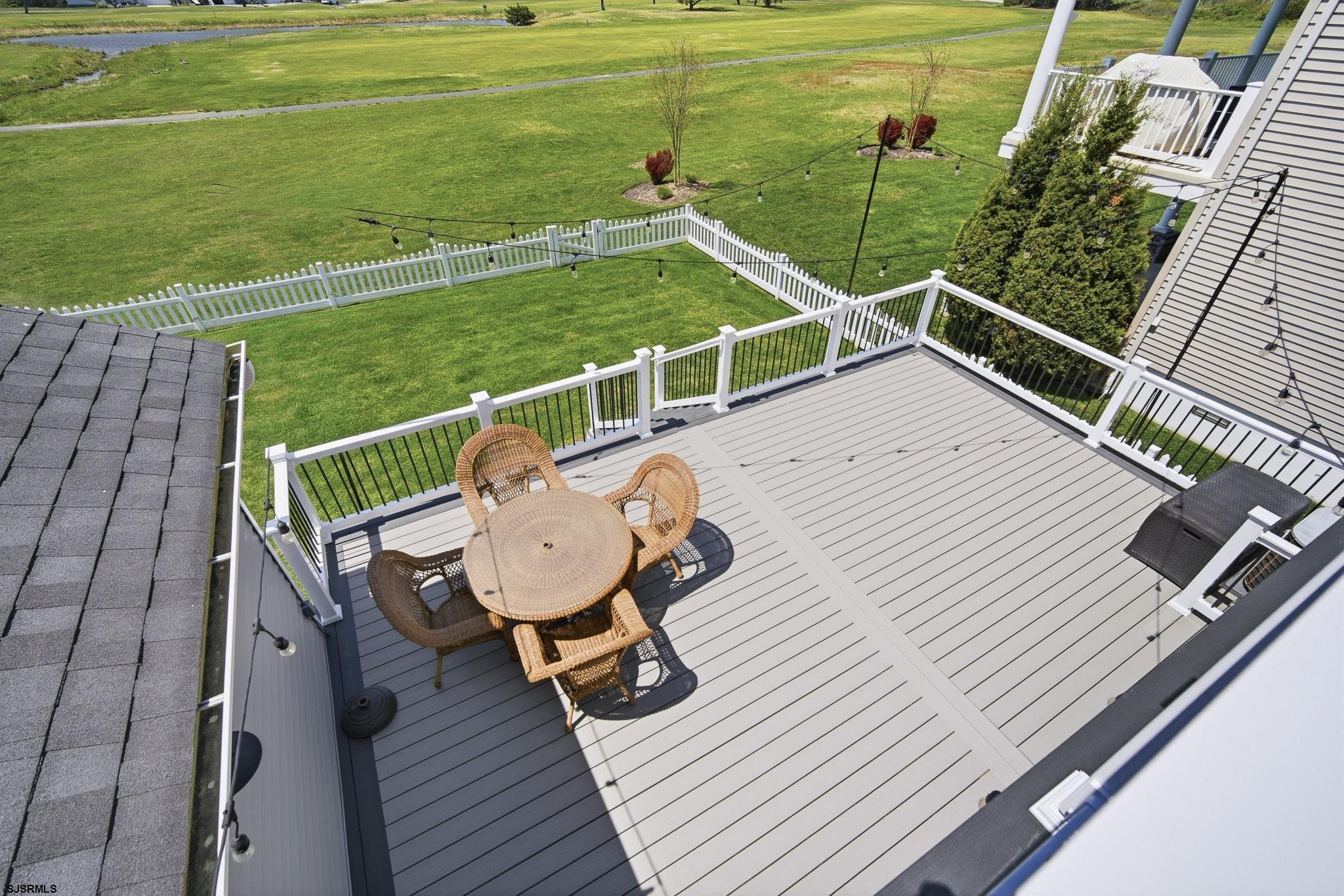 214 Hagen Road Brigantine, NJ 08203 - Photo 30 of 34 a view of a deck with chairs and wooden floor
