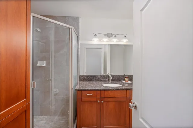 a view of a lake with houses in the back