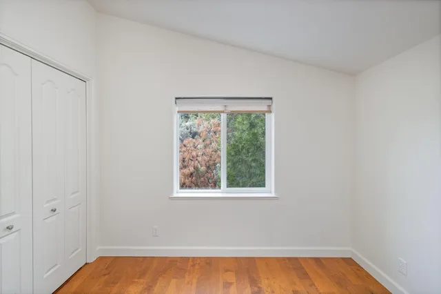 a view of a two chairs and table in the balcony