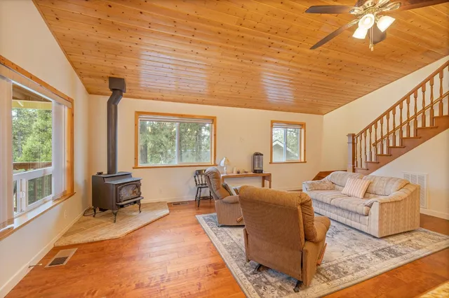 a kitchen with stainless steel appliances granite countertop a refrigerator and a stove