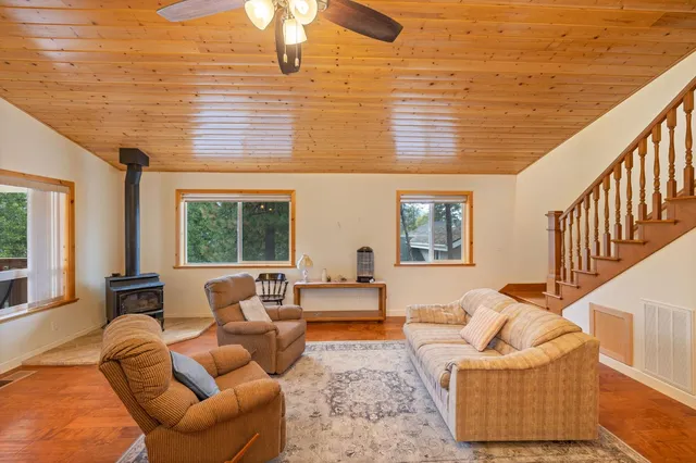 a kitchen with stainless steel appliances granite countertop a sink a stove and a refrigerator