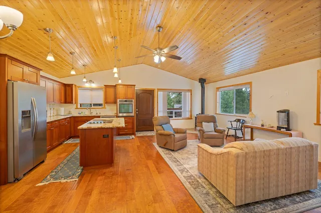 a kitchen with stainless steel appliances a sink and cabinets