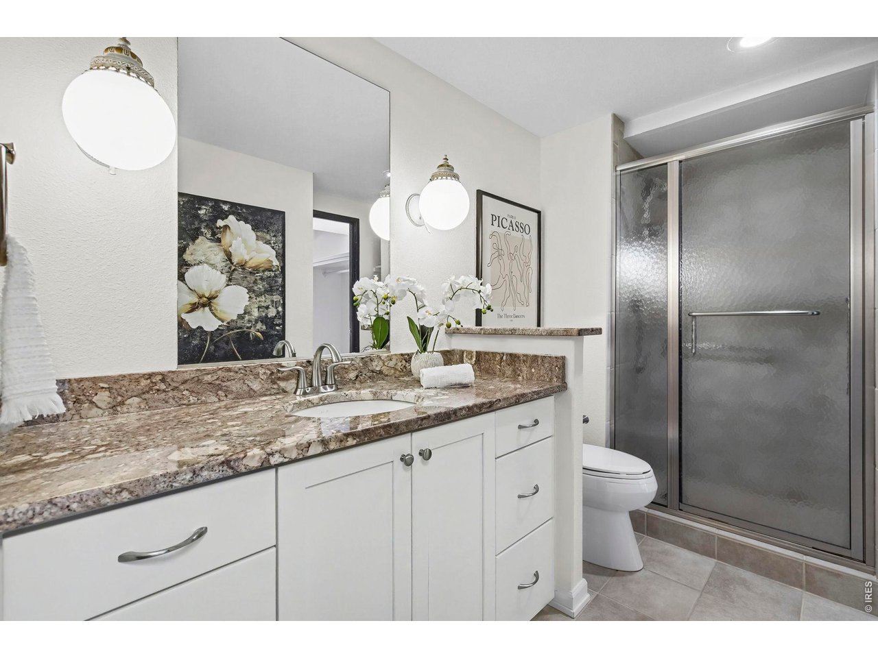 415 South Howes Street, Unit 807 Fort Collins, CO 80521 - Photo 18 of 31 Granite and custom cabinets complete this bathroom