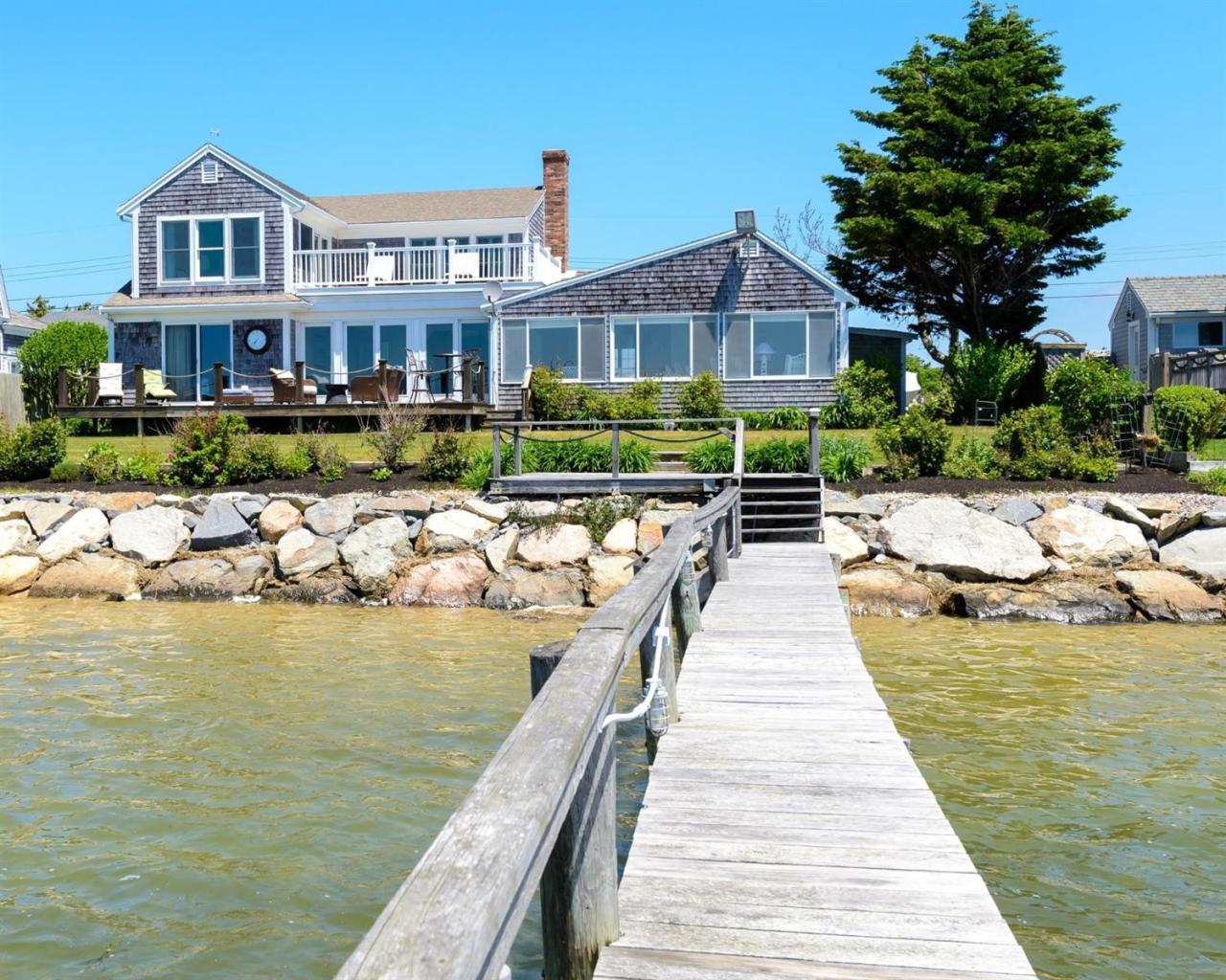 a front view of a house with a ocean view