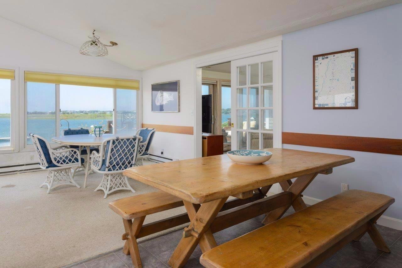 11 Riverside Way West Dennis, MA 02670 - Photo 11 of 25 a view of a dining room with furniture window and outside view