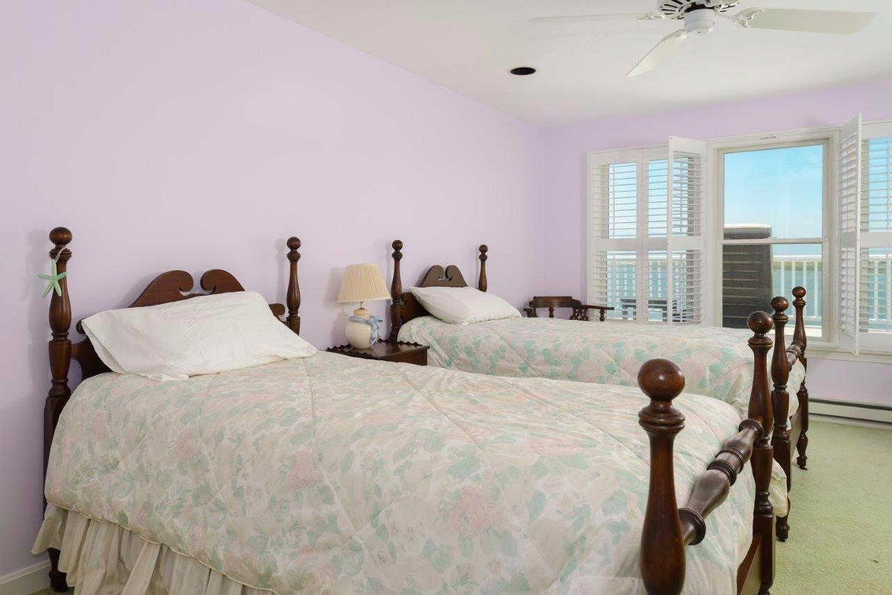 11 Riverside Way West Dennis, MA 02670 - Photo 15 of 25 a large bedroom with bed and window