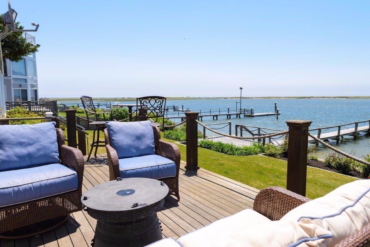 11 Riverside Way West Dennis, MA 02670 - Photo 18 of 25 a view of a terrace with furniture