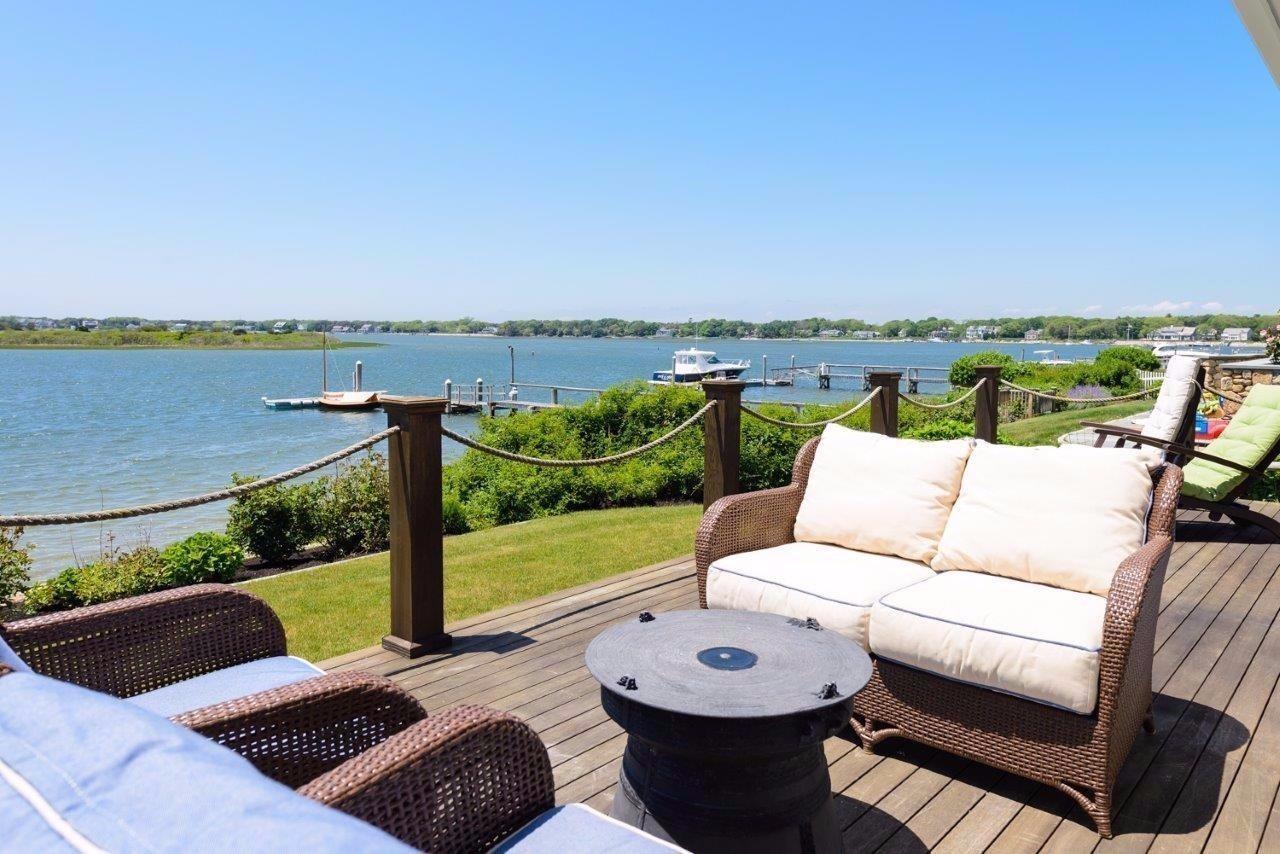 11 Riverside Way West Dennis, MA 02670 - Photo 19 of 25 a view of a terrace with couches and pool