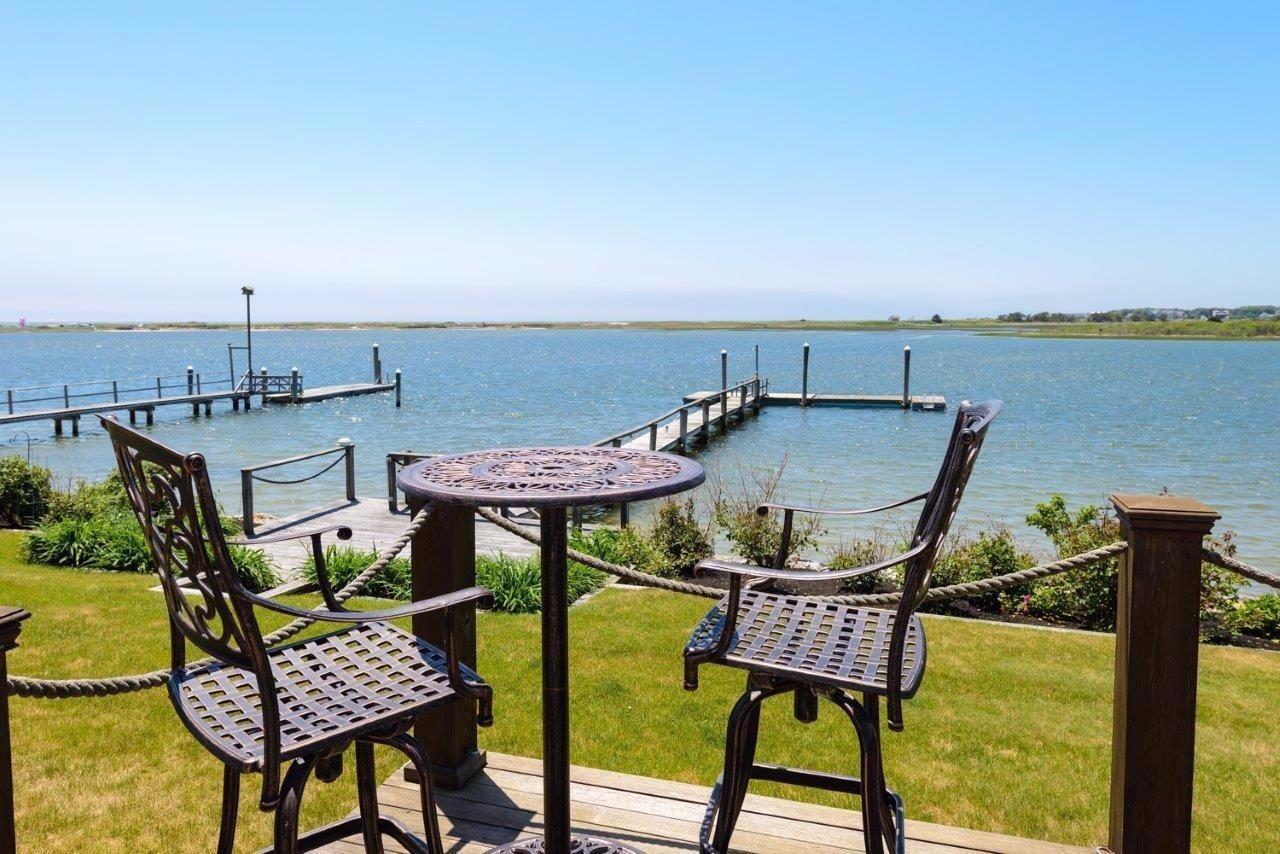 11 Riverside Way West Dennis, MA 02670 - Photo 20 of 25 a view of a chairs and table in patio