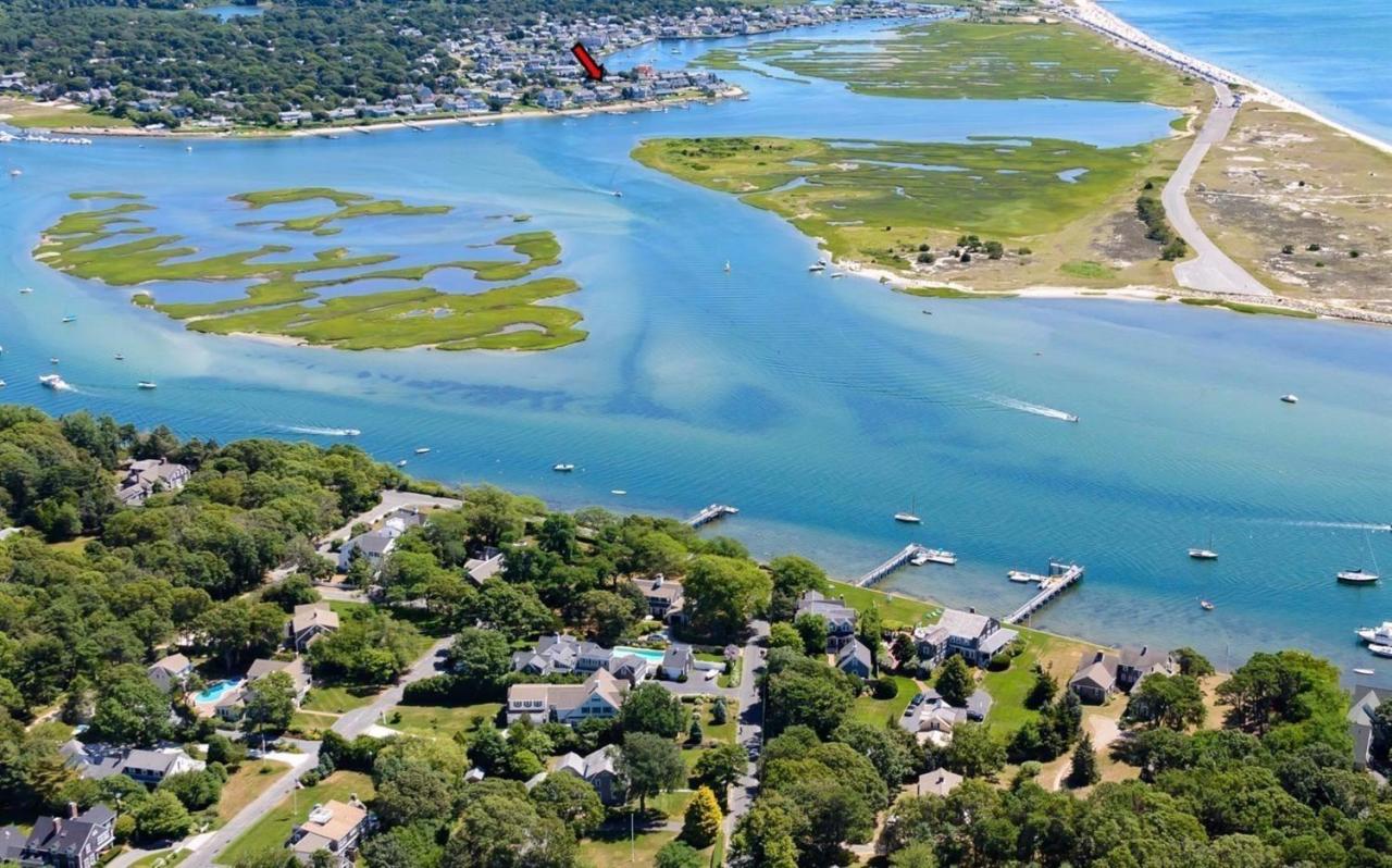 11 Riverside Way West Dennis, MA 02670 - Photo 2 of 25 an aerial view of a house with a swimming pool