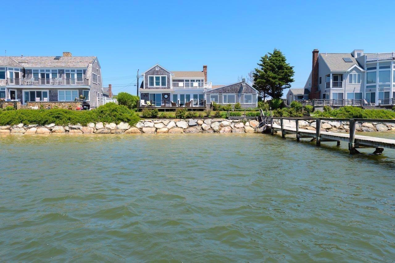 11 Riverside Way West Dennis, MA 02670 - Photo 22 of 25 a view of multiple houses with a yard