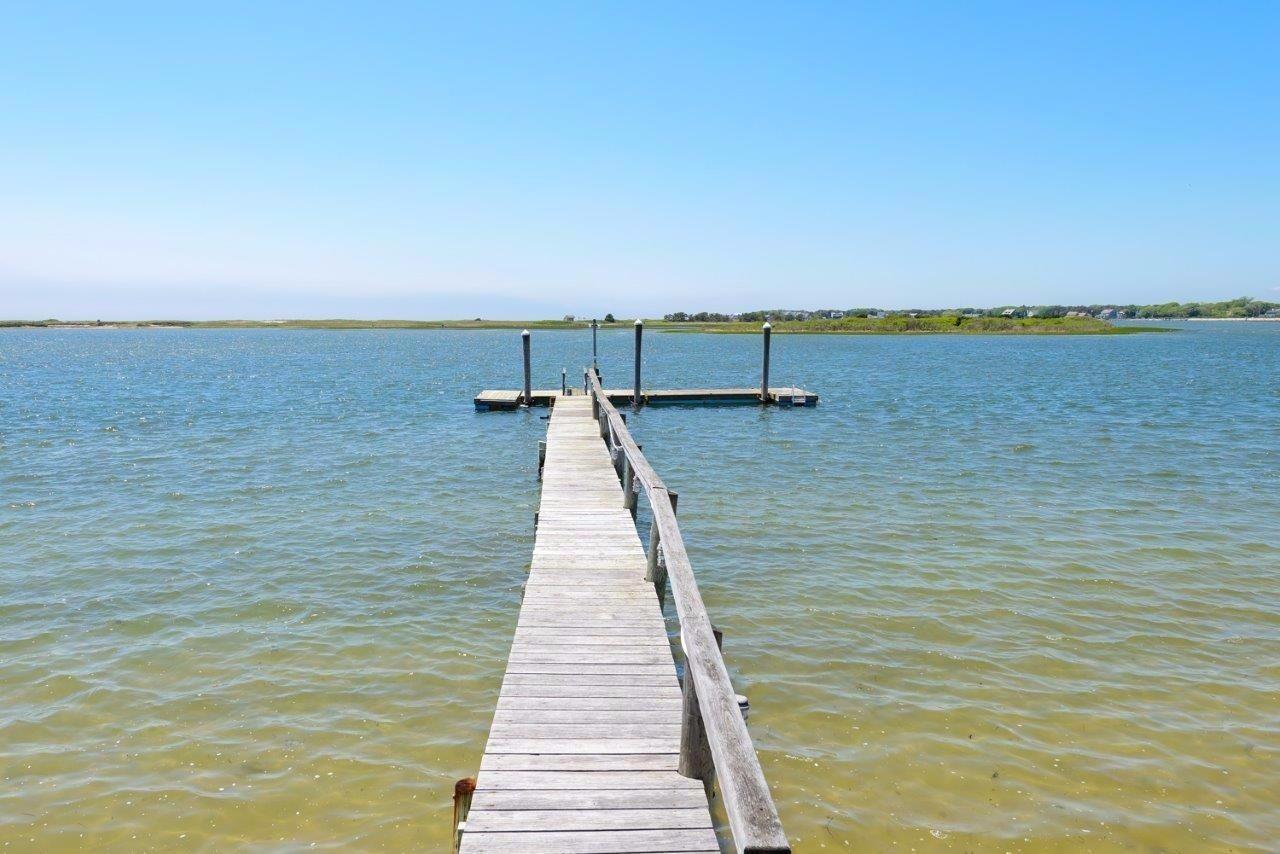11 Riverside Way West Dennis, MA 02670 - Photo 23 of 25 a view of a swimming pool and an outdoor seating