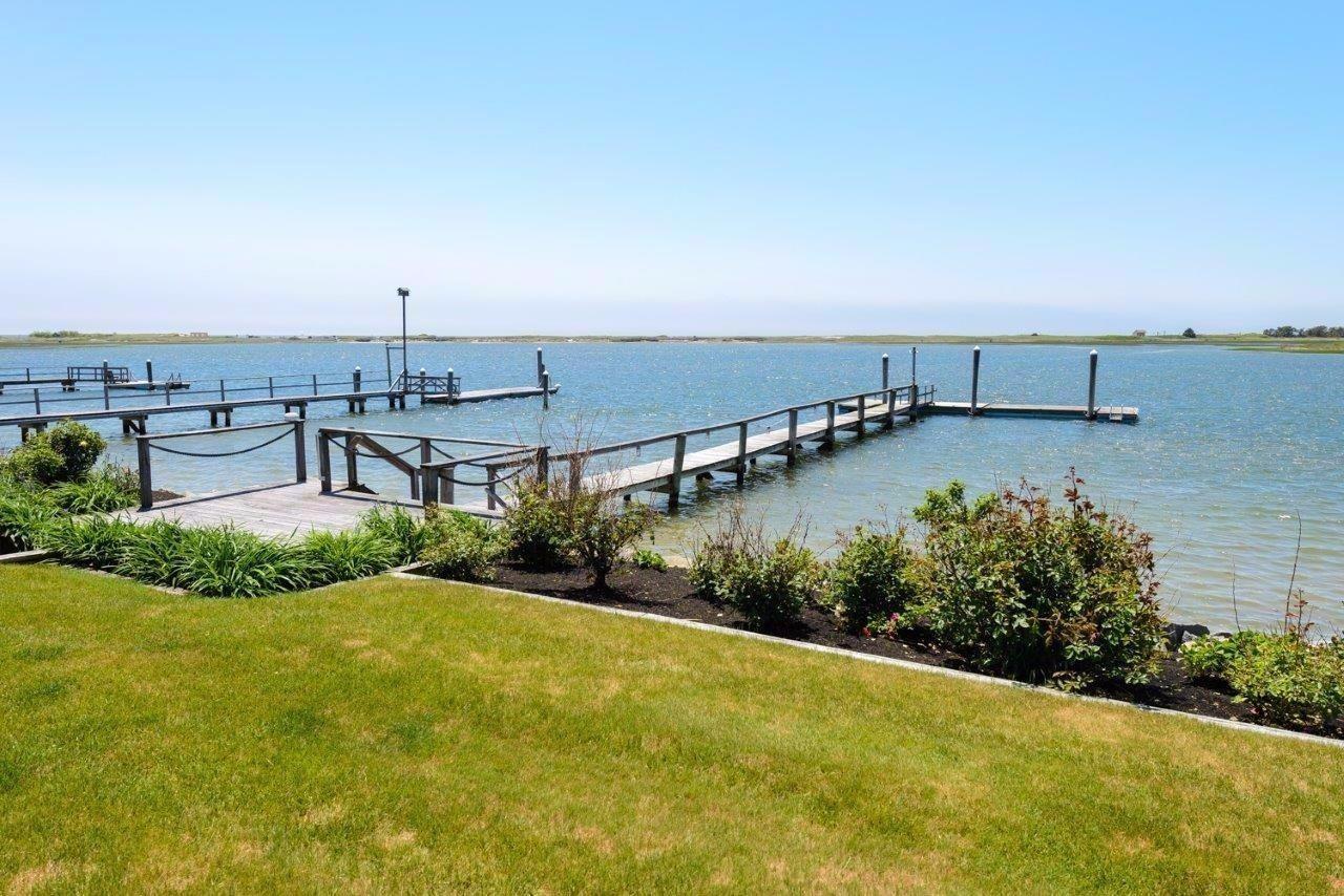 11 Riverside Way West Dennis, MA 02670 - Photo 4 of 25 a view of a terrace with a garden and mountain view