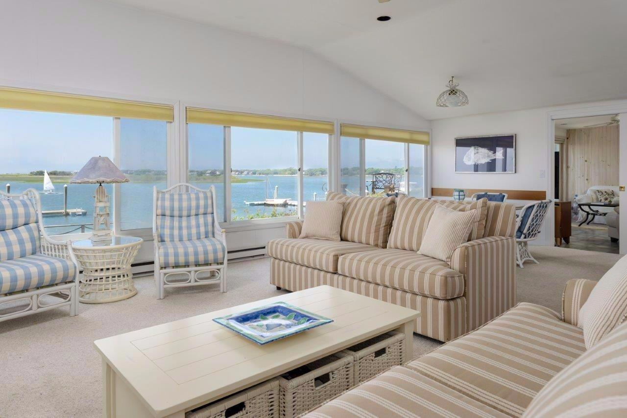 11 Riverside Way West Dennis, MA 02670 - Photo 6 of 25 a living room with furniture and a large window