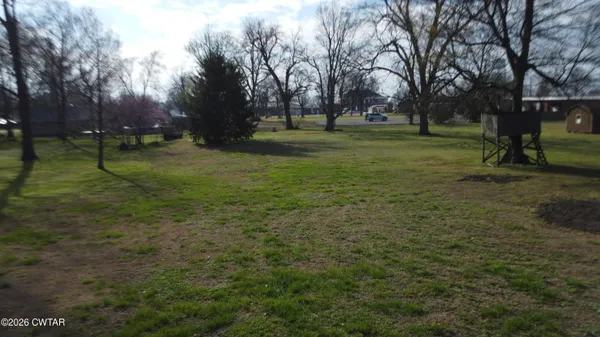 a view of a park with trees