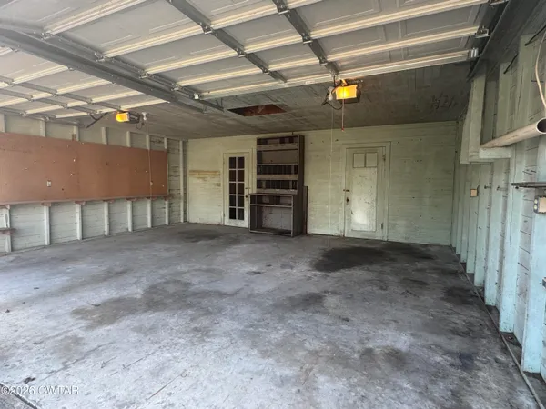 a view of an empty room with stairs