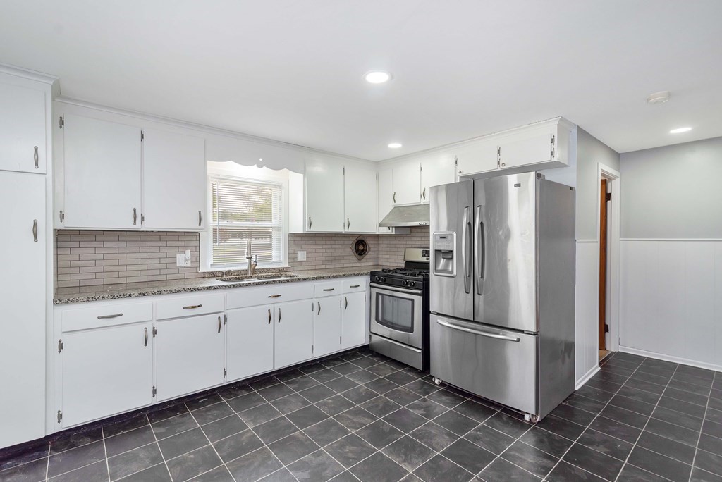 14 Scarsdale Road Springfield, MA 01129 - Photo 11 of 42 a kitchen with granite countertop white cabinets and stainless steel appliances