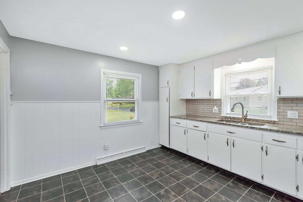 14 Scarsdale Road Springfield, MA 01129 - Photo 13 of 42 a kitchen with granite countertop white cabinets a sink and dishwasher
