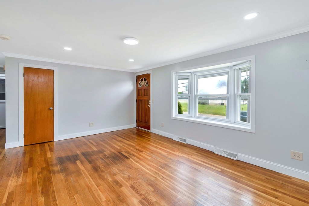 14 Scarsdale Road Springfield, MA 01129 - Photo 20 of 42 a view of an empty room with window and wooden floor