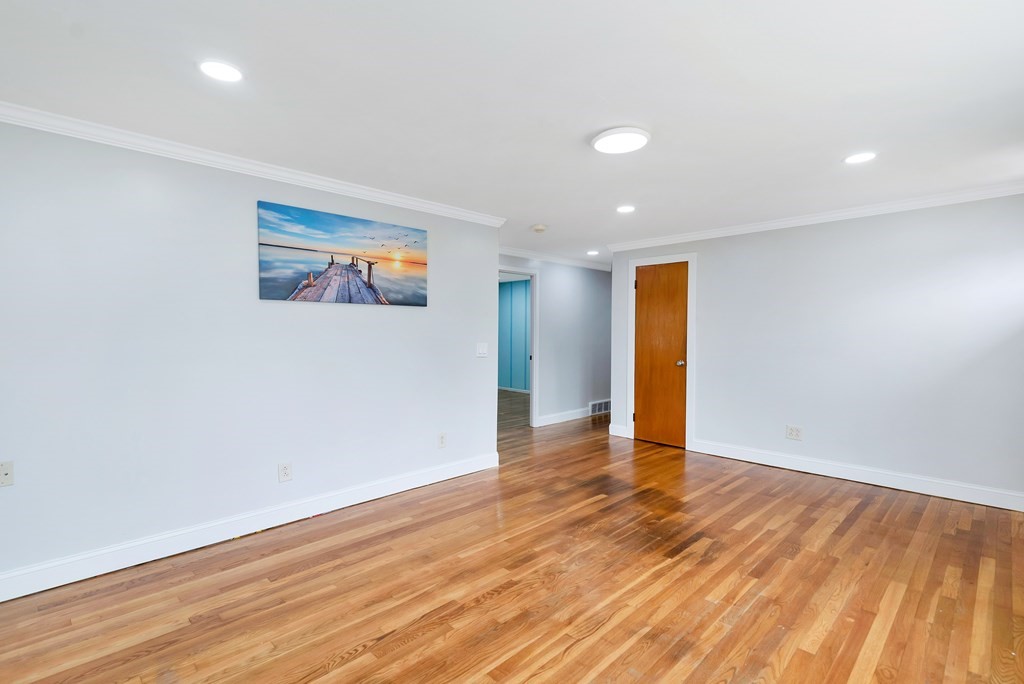 14 Scarsdale Road Springfield, MA 01129 - Photo 21 of 42 a view of an empty room with wooden floor and a window