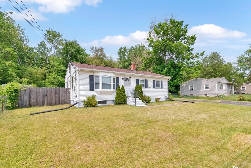 14 Scarsdale Road Springfield, MA 01129 - Photo 3 of 42 a front view of house with yard and trees in the background