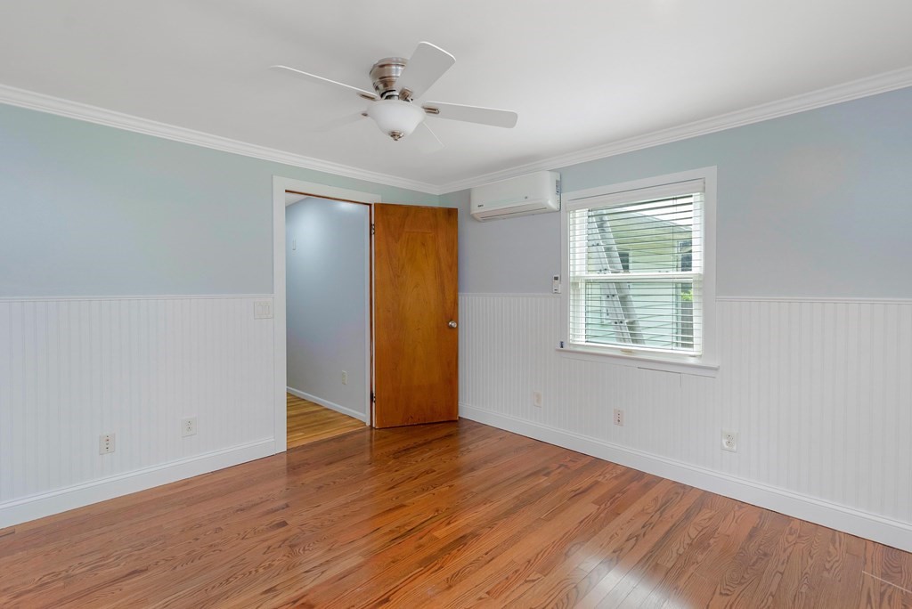 14 Scarsdale Road Springfield, MA 01129 - Photo 31 of 42 an empty room with wooden floor chandelier fan and windows