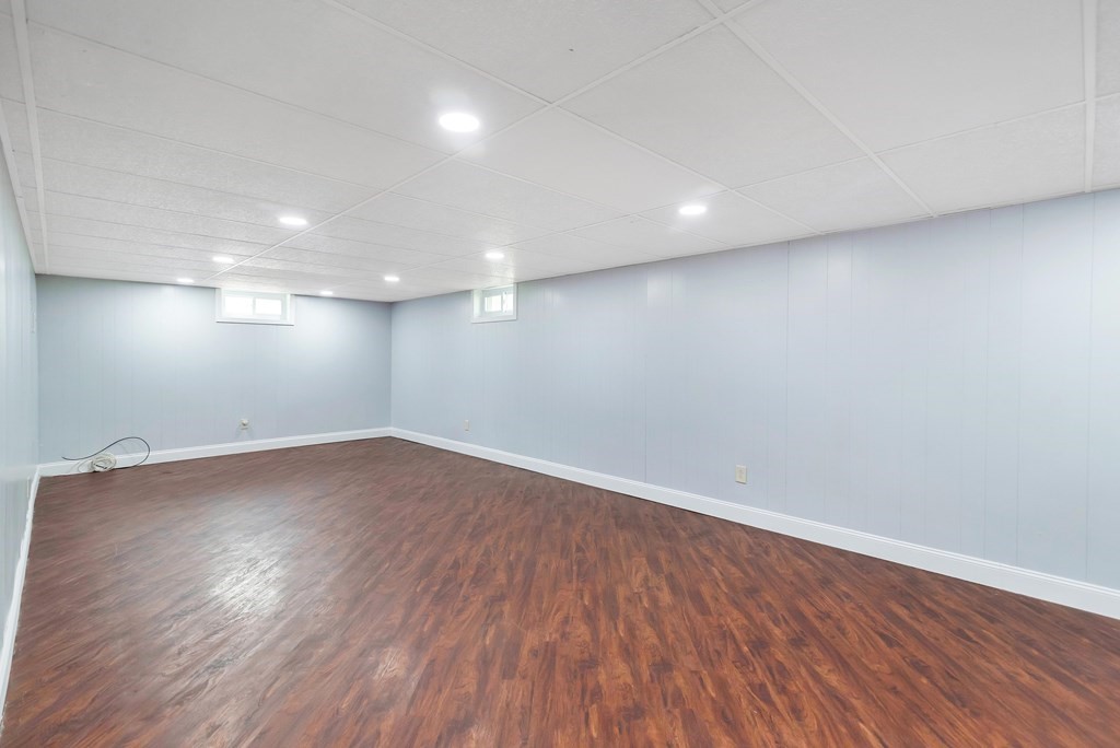 14 Scarsdale Road Springfield, MA 01129 - Photo 34 of 42 an empty room with wooden floor and windows