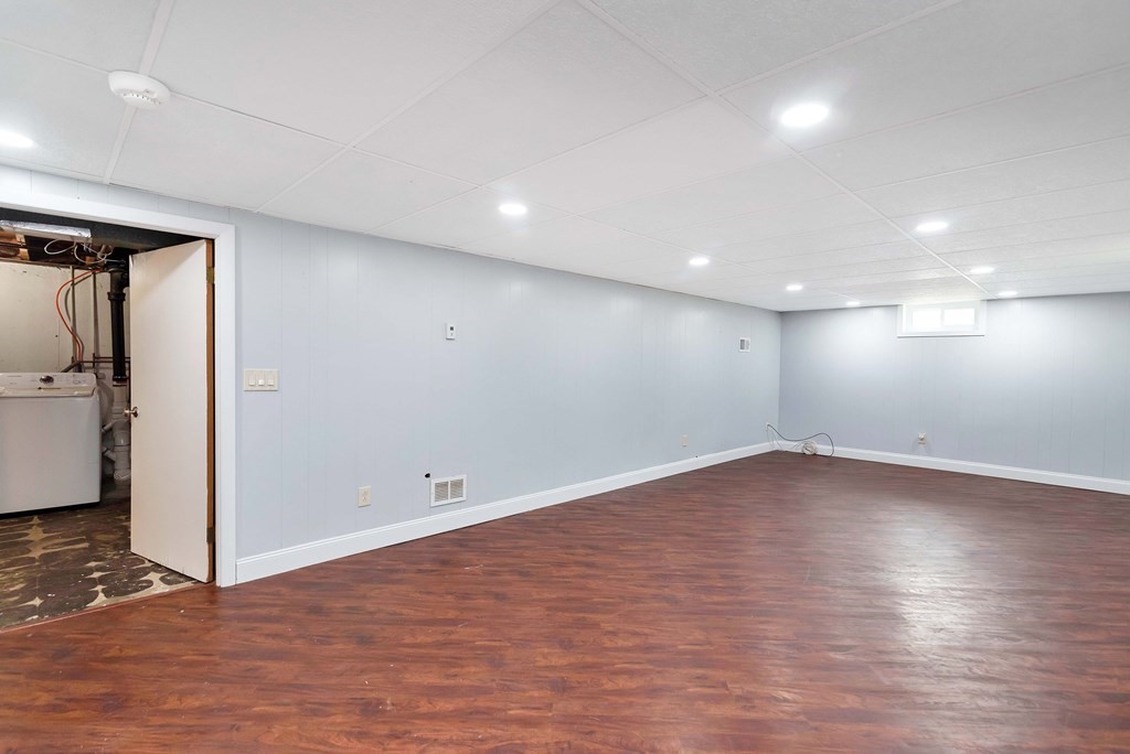 14 Scarsdale Road Springfield, MA 01129 - Photo 37 of 42 an empty room with wooden floor and windows