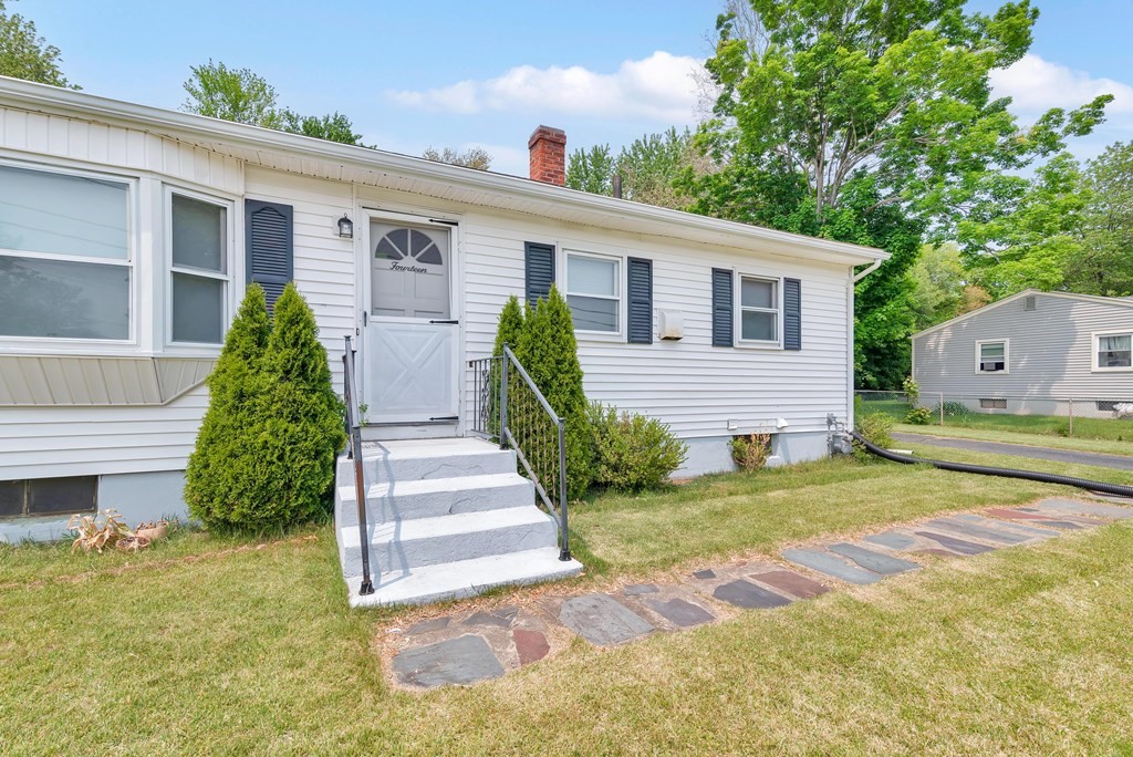 14 Scarsdale Road Springfield, MA 01129 - Photo 4 of 42 a front view of a house with a yard and garage
