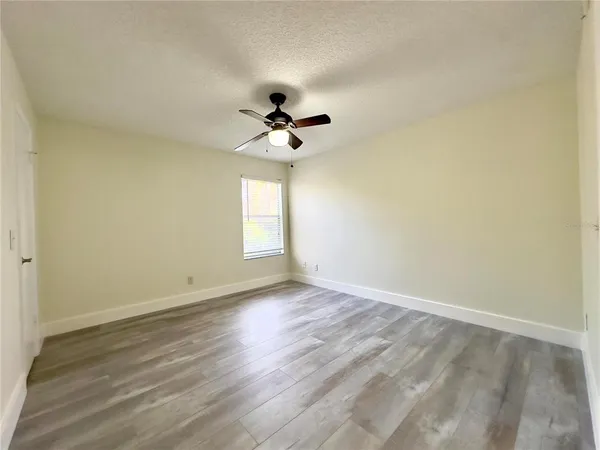 a view of an empty room with a window