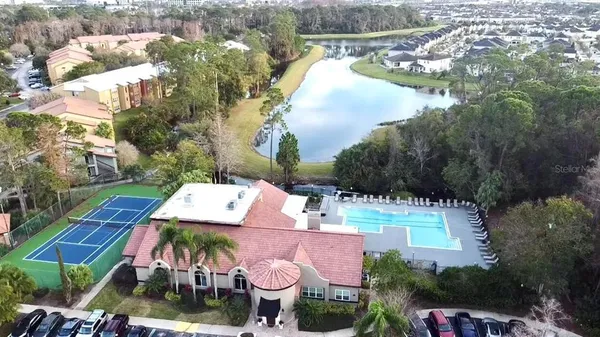an aerial view of a house with yard swimming pool and outdoor seating