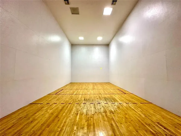 a view of empty room with ceiling fan