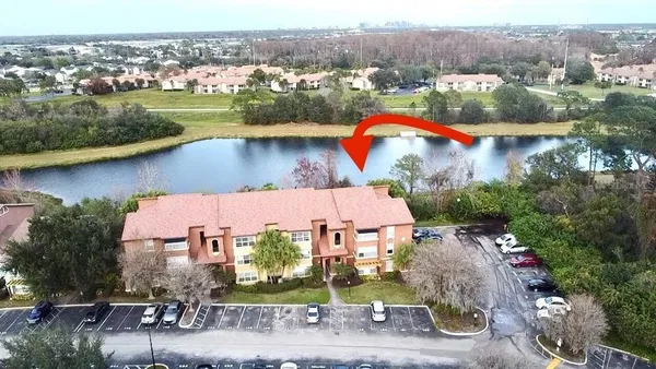 an aerial view of a house with outdoor space