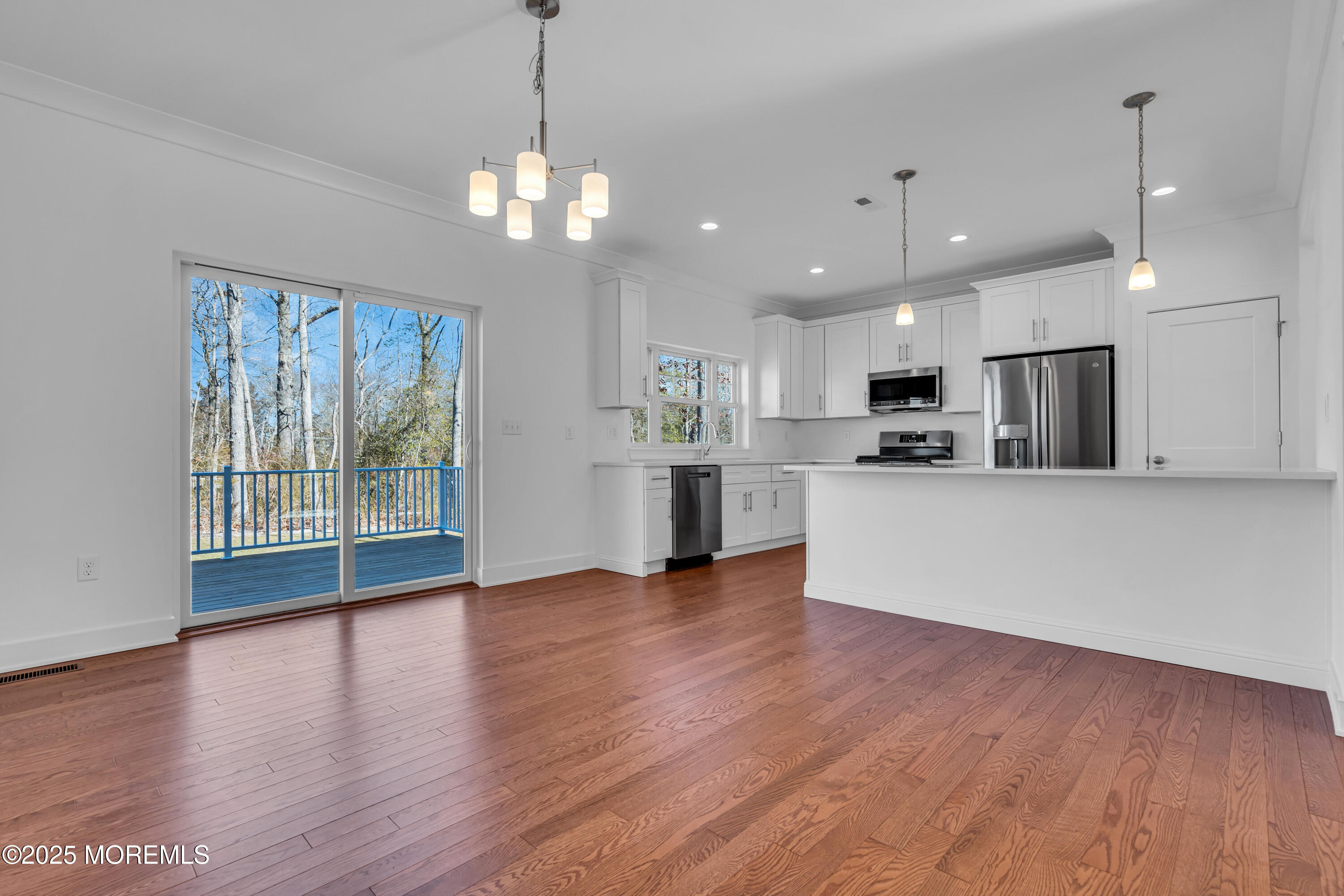35 Pennsylvania Avenue Waretown, NJ 08758 - Photo 16 of 65 a view of a kitchen with a refrigerator wooden floor and a window