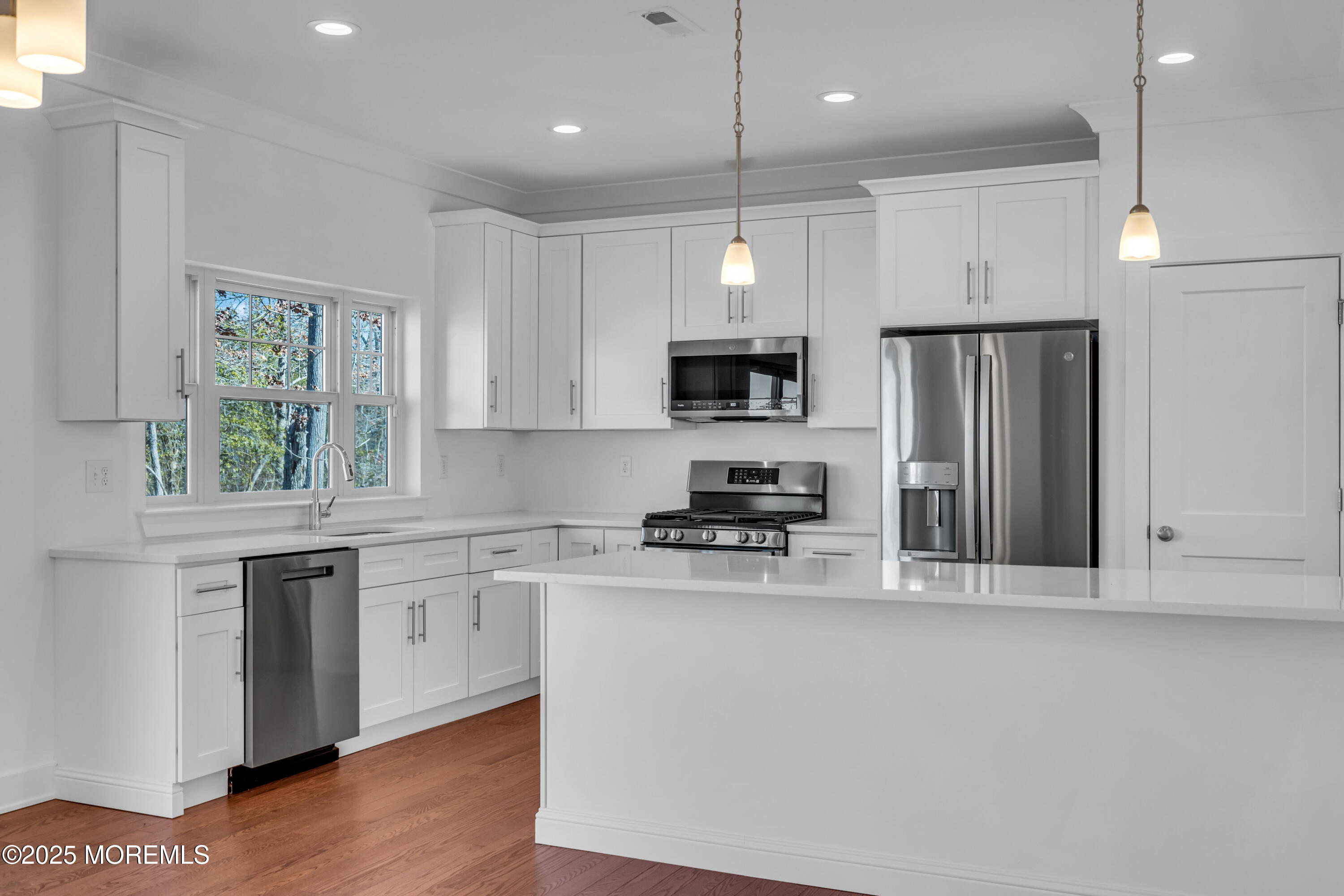 35 Pennsylvania Avenue Waretown, NJ 08758 - Photo 17 of 65 a kitchen with stainless steel appliances granite countertop a stove a sink and a refrigerator