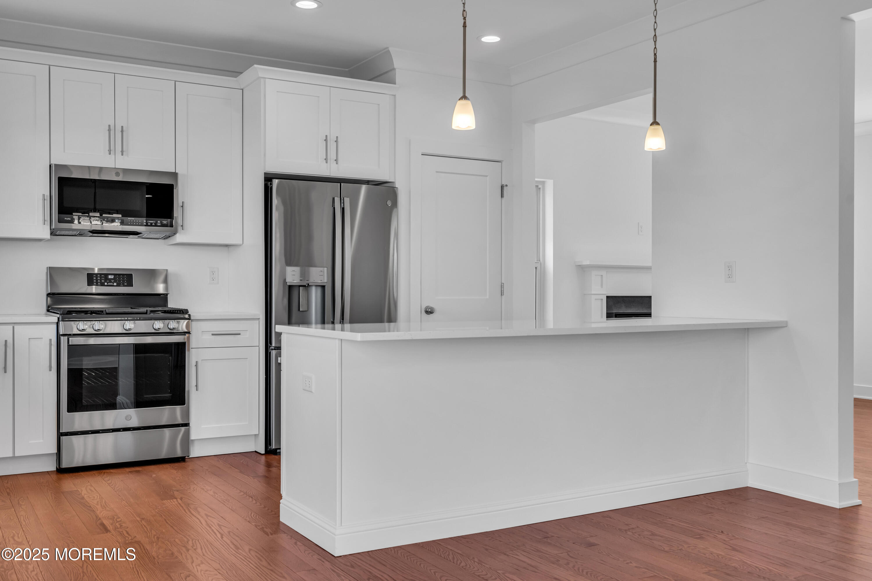35 Pennsylvania Avenue Waretown, NJ 08758 - Photo 20 of 65 a kitchen with stainless steel appliances a stove a microwave and a hard wood floors