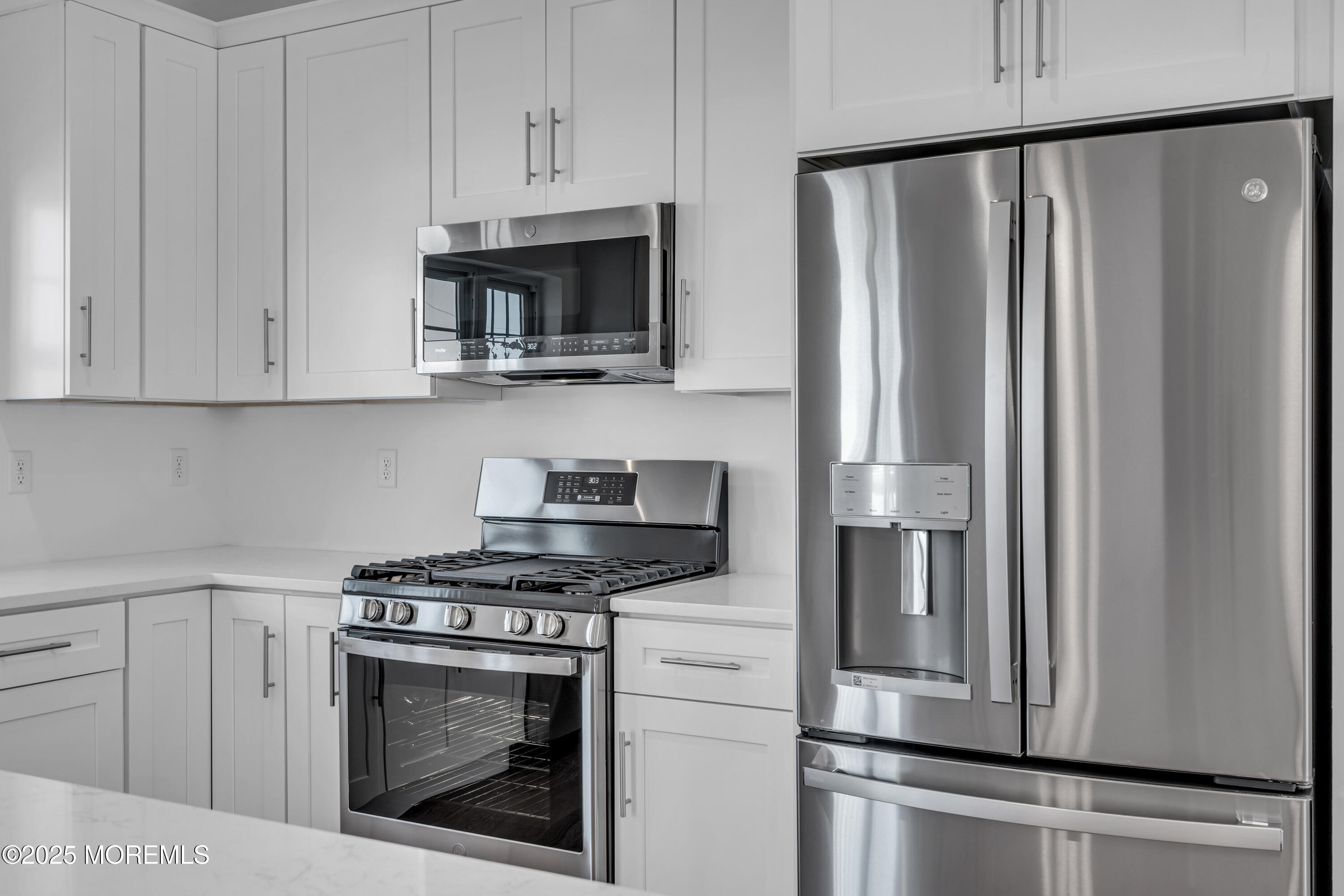 35 Pennsylvania Avenue Waretown, NJ 08758 - Photo 23 of 65 a kitchen with stainless steel appliances white cabinets and a stove