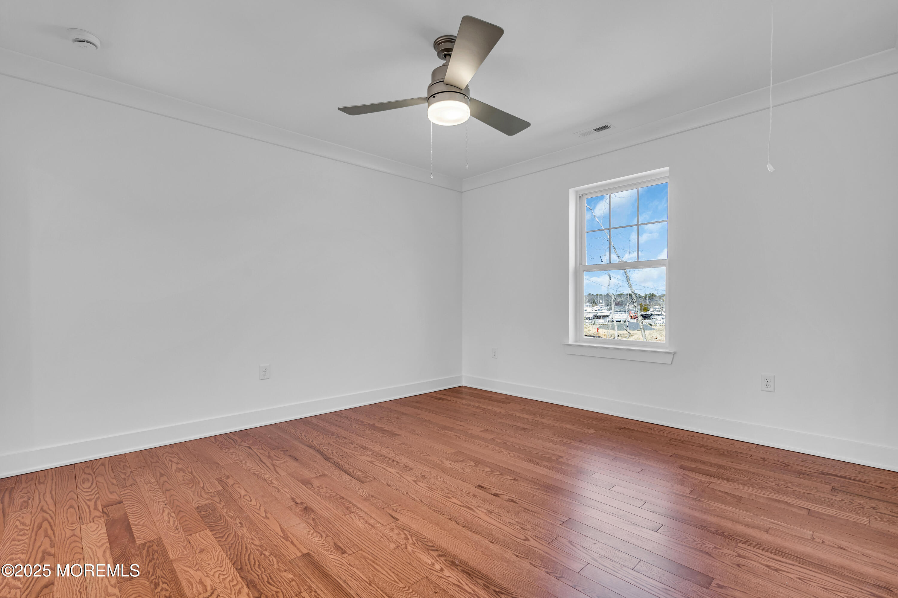 35 Pennsylvania Avenue Waretown, NJ 08758 - Photo 35 of 65 wooden floor in an empty room with a window