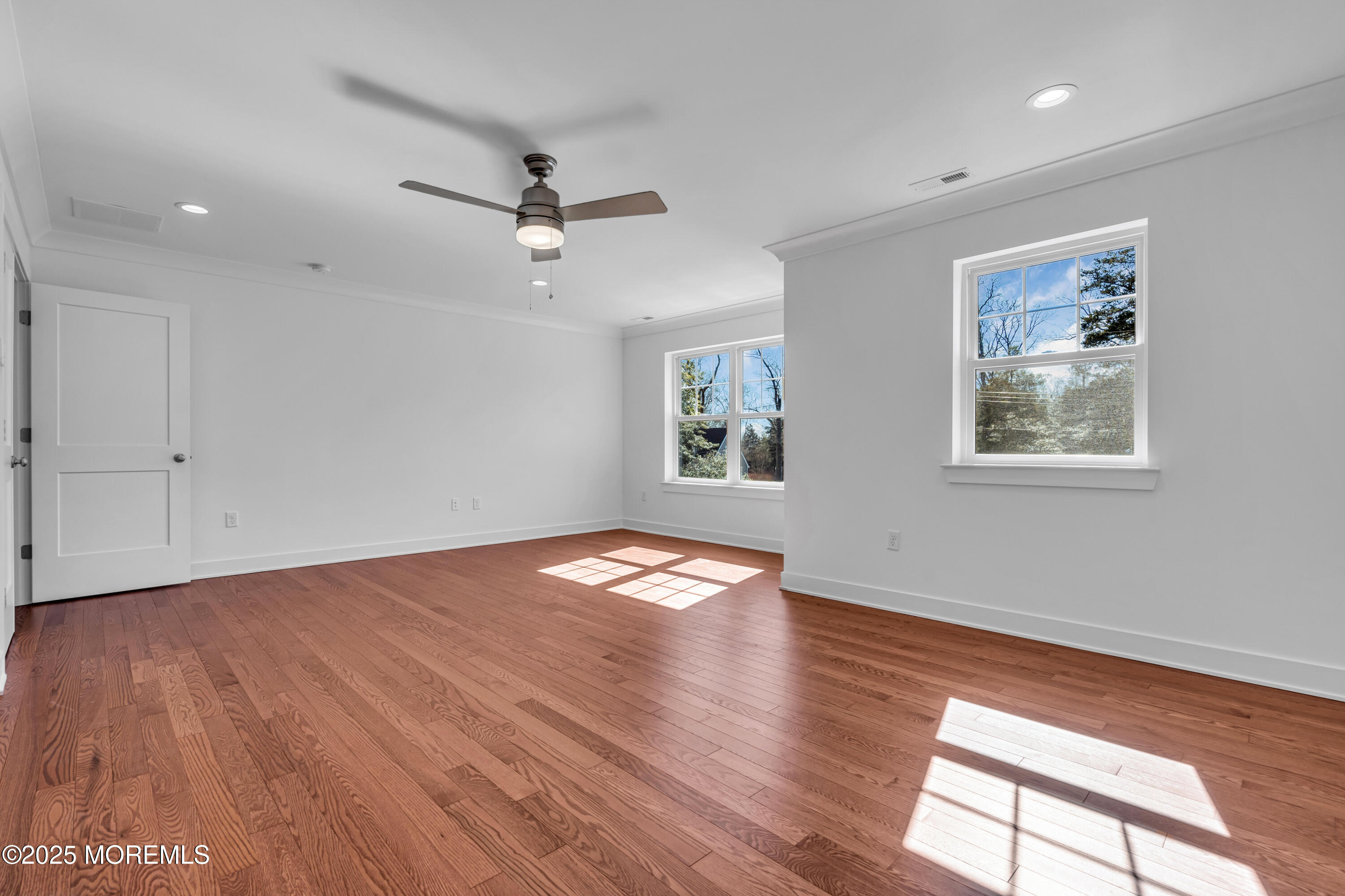 35 Pennsylvania Avenue Waretown, NJ 08758 - Photo 41 of 65 a view of empty room with wooden floor and fan