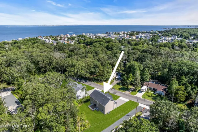a view of an empty room and wooden floor in a room