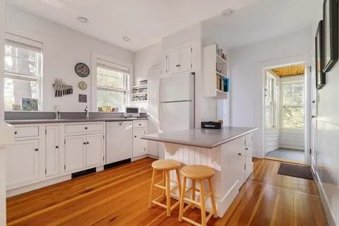 a kitchen with stainless steel appliances granite countertop a sink and cabinets