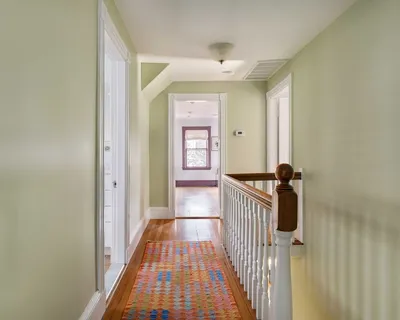 a view of a hallway with a white walls